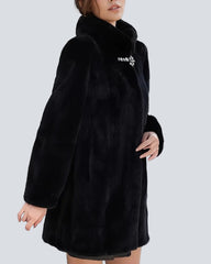 Black coat with high collar and jeweled button