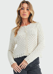 White pointelle cardigan with wavy hem
