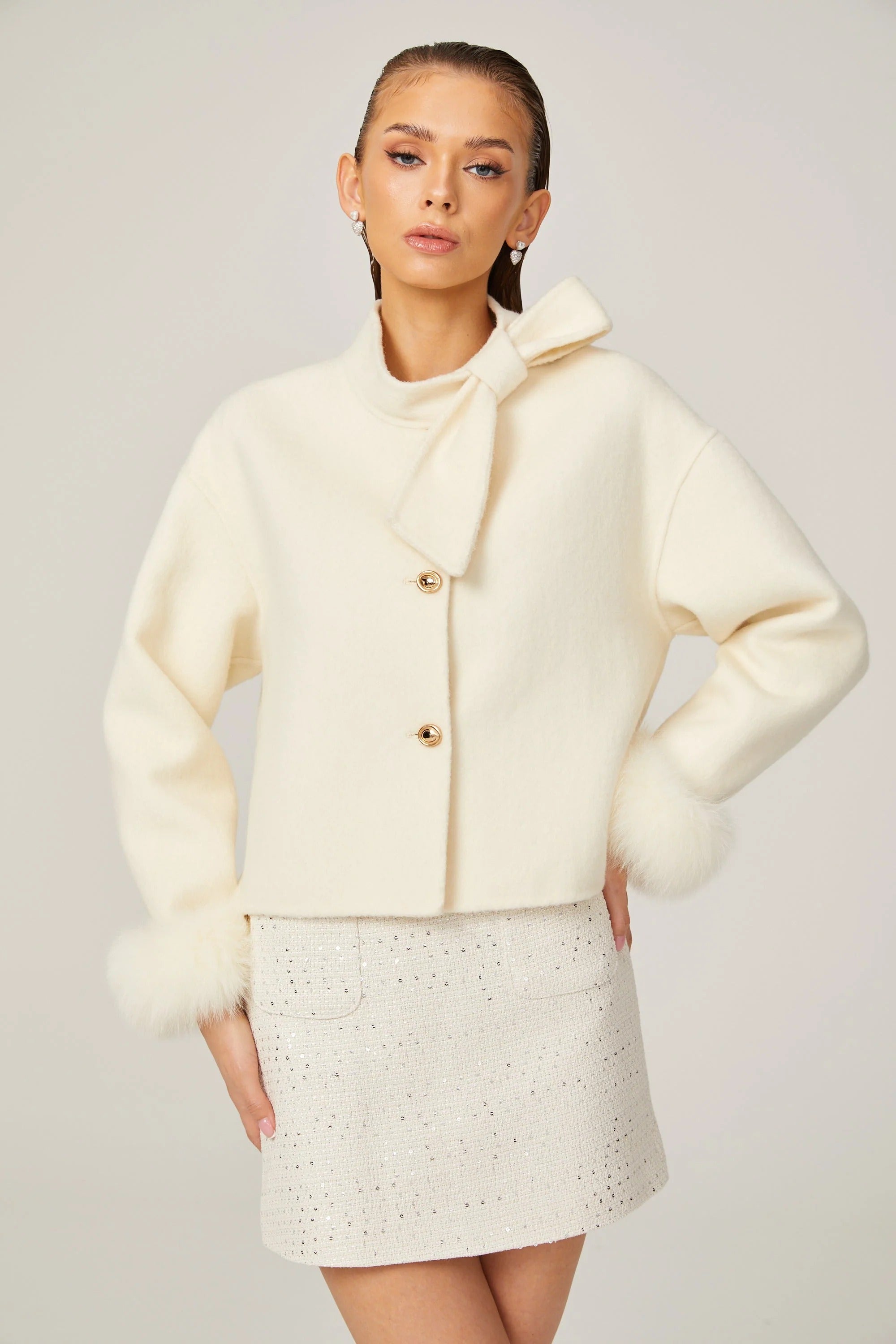 Cream short jacket with bow collar and fluffy cuffs