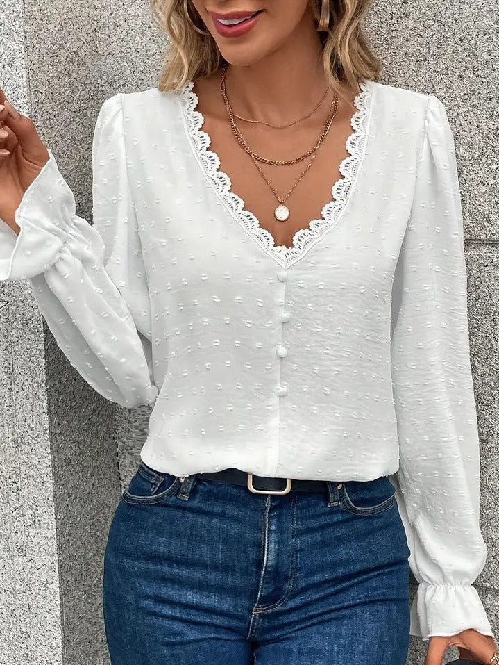 Blouse with lace trim and puff sleeves