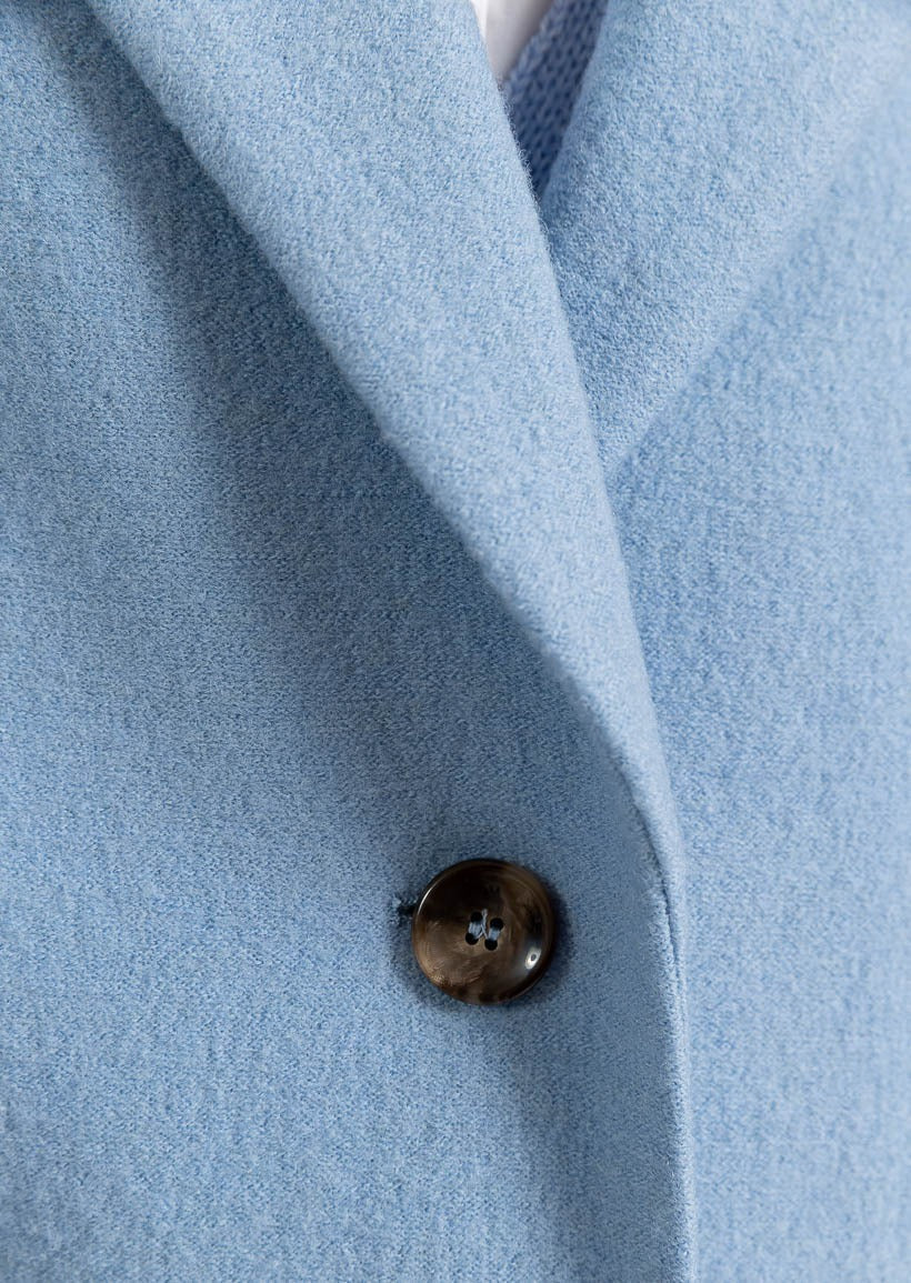 Light blue long coat with outside pockets