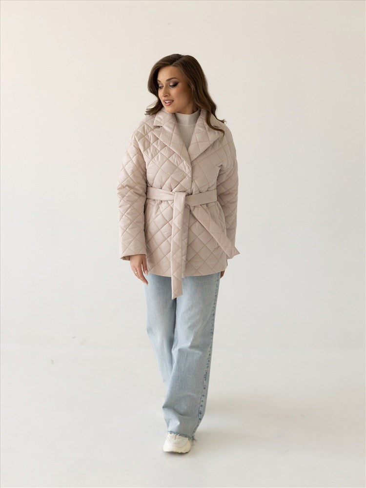 Beige quilted jacket with belt and shawl collar