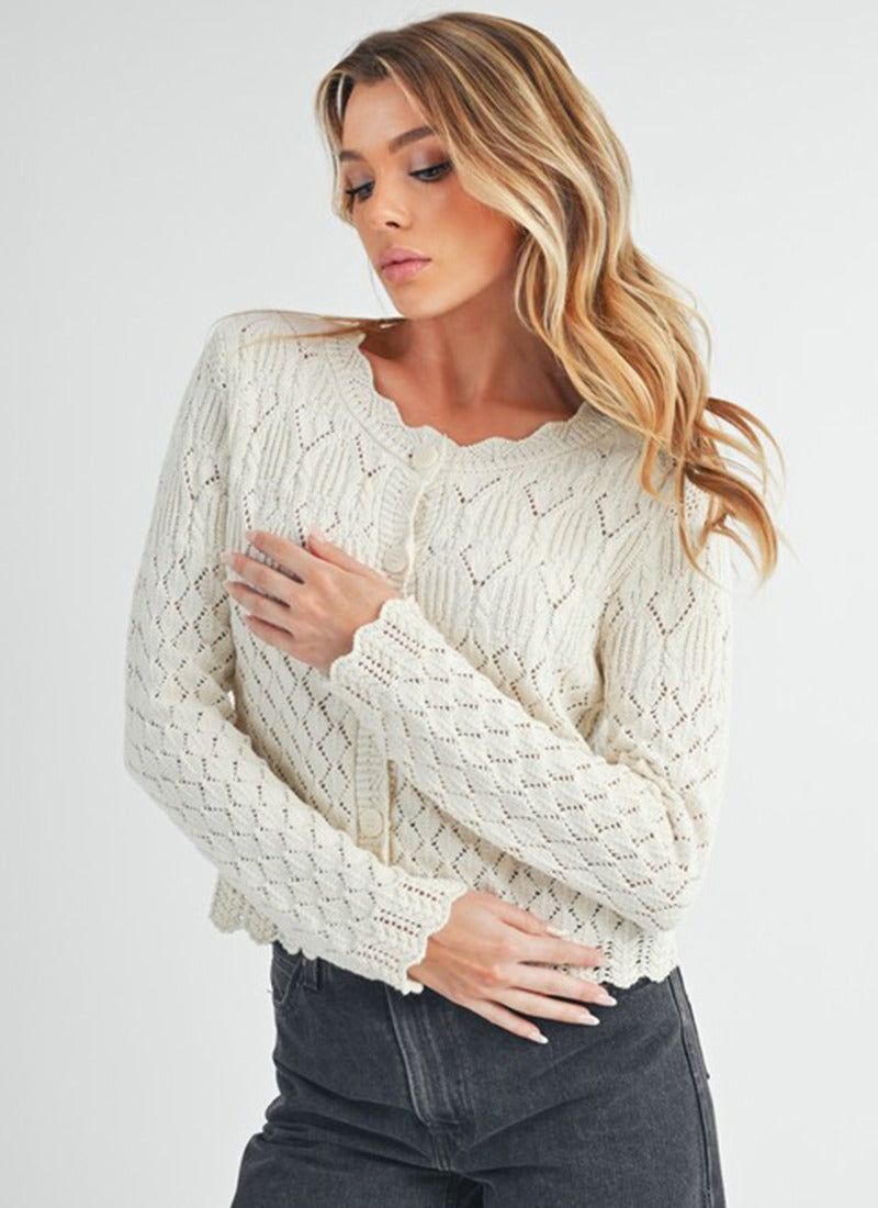 White pointelle cardigan with wavy hem