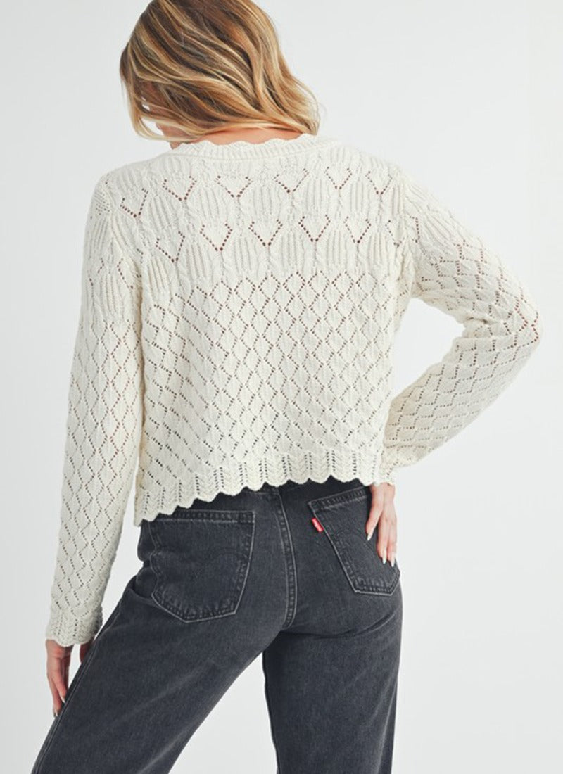 White pointelle cardigan with wavy hem