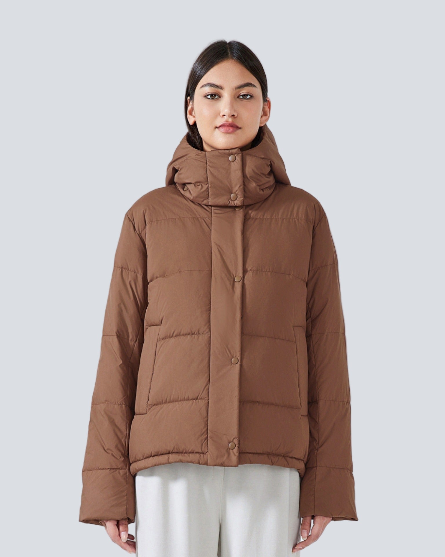 Short padded jacket with hood and high collar
