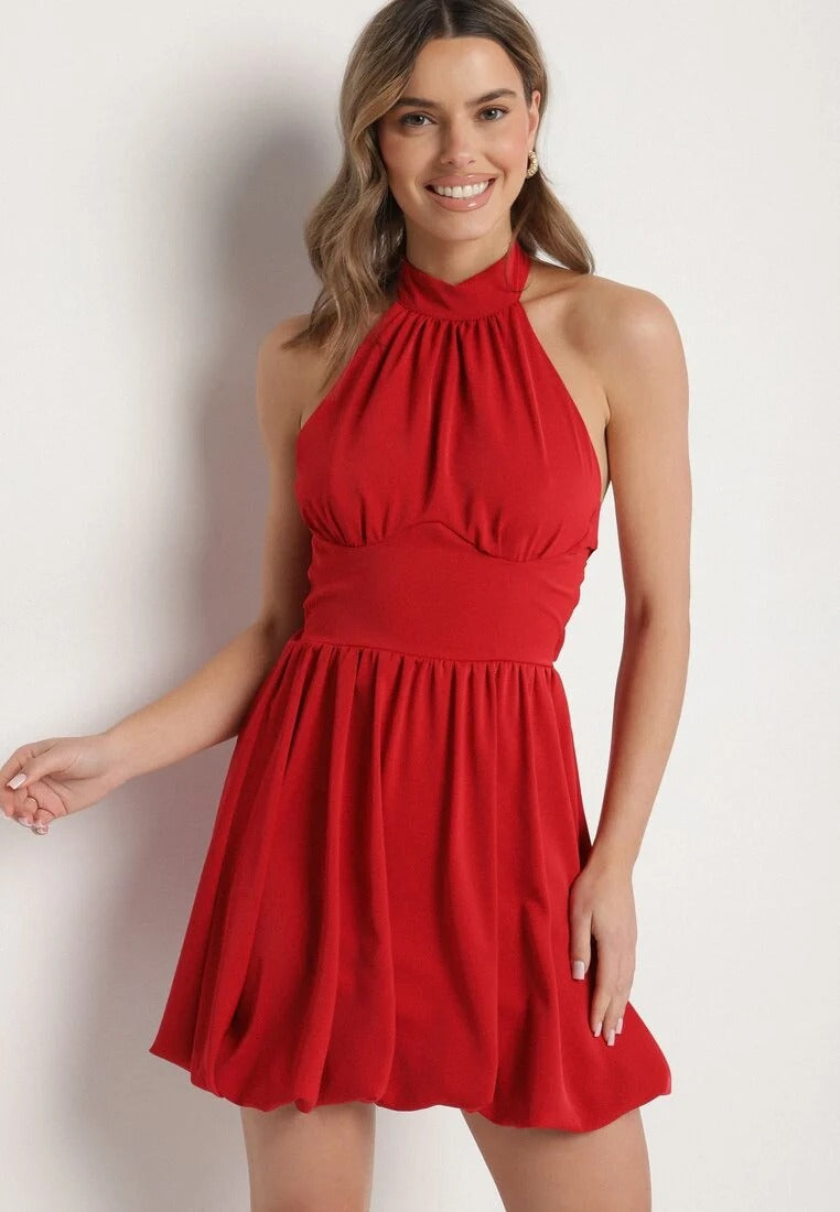 Backless mini dress with pleated skirt