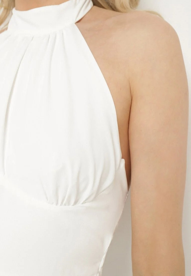 Backless mini dress with pleated skirt