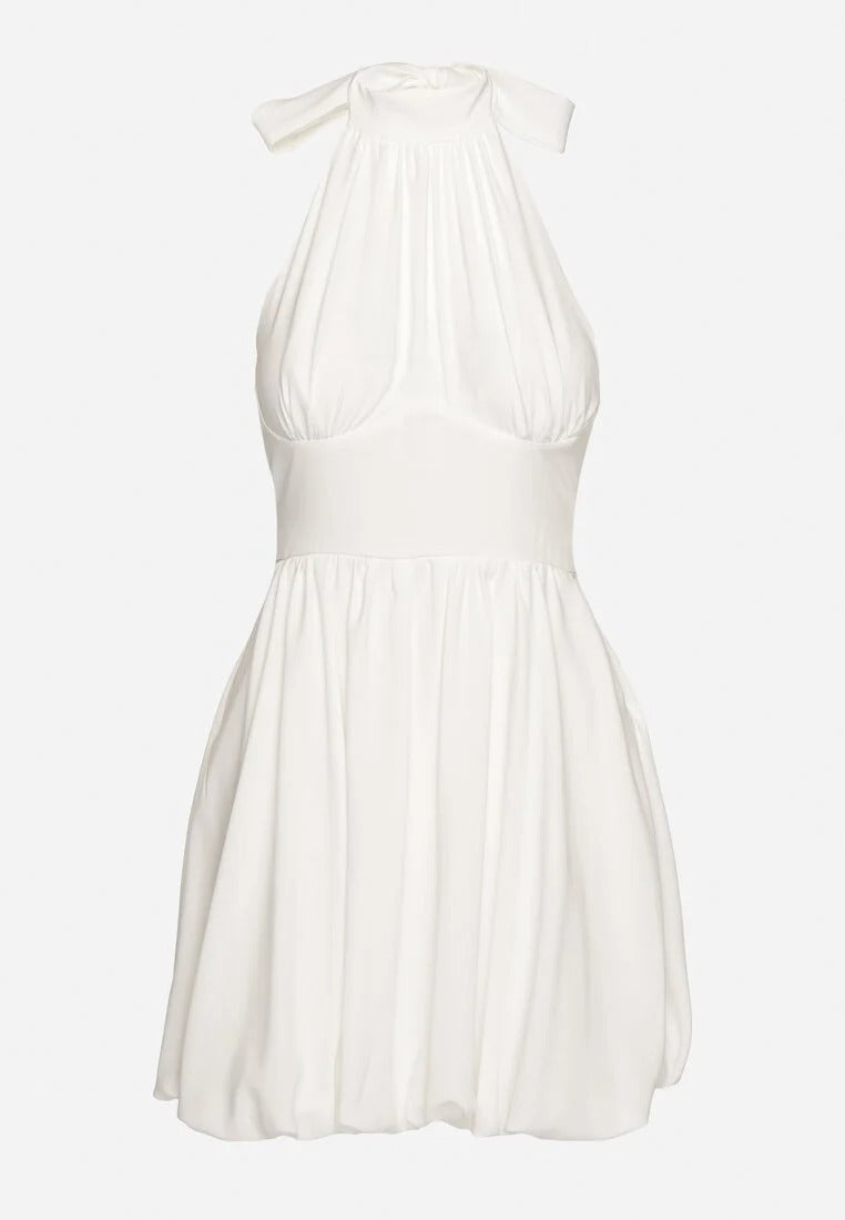 Backless mini dress with pleated skirt