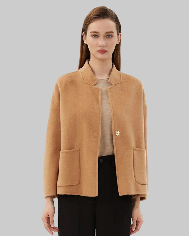 Boxy short jacket with single button closure