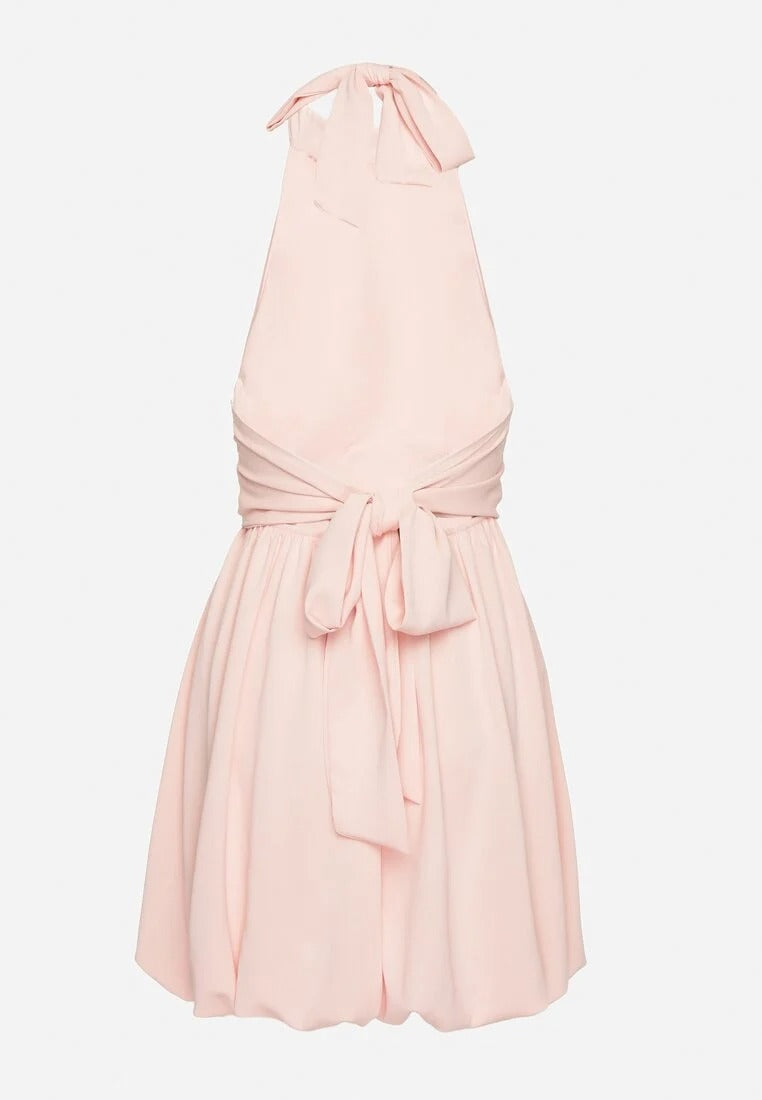 Backless mini dress with pleated skirt