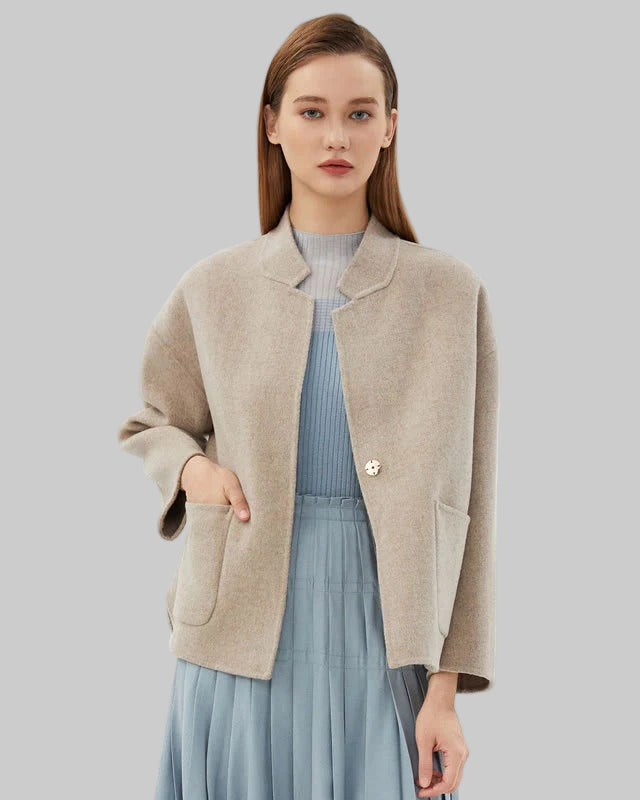 Boxy short jacket with single button closure