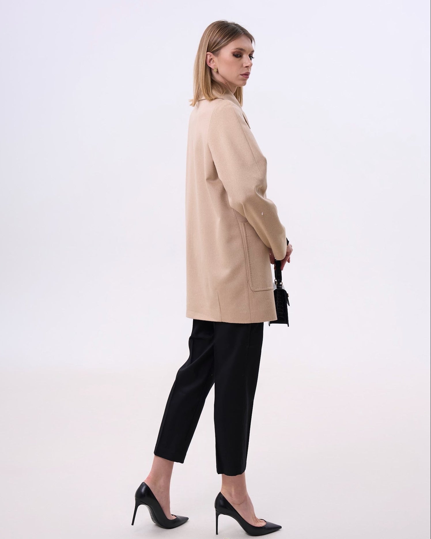 Beige coat with round collar and large pockets