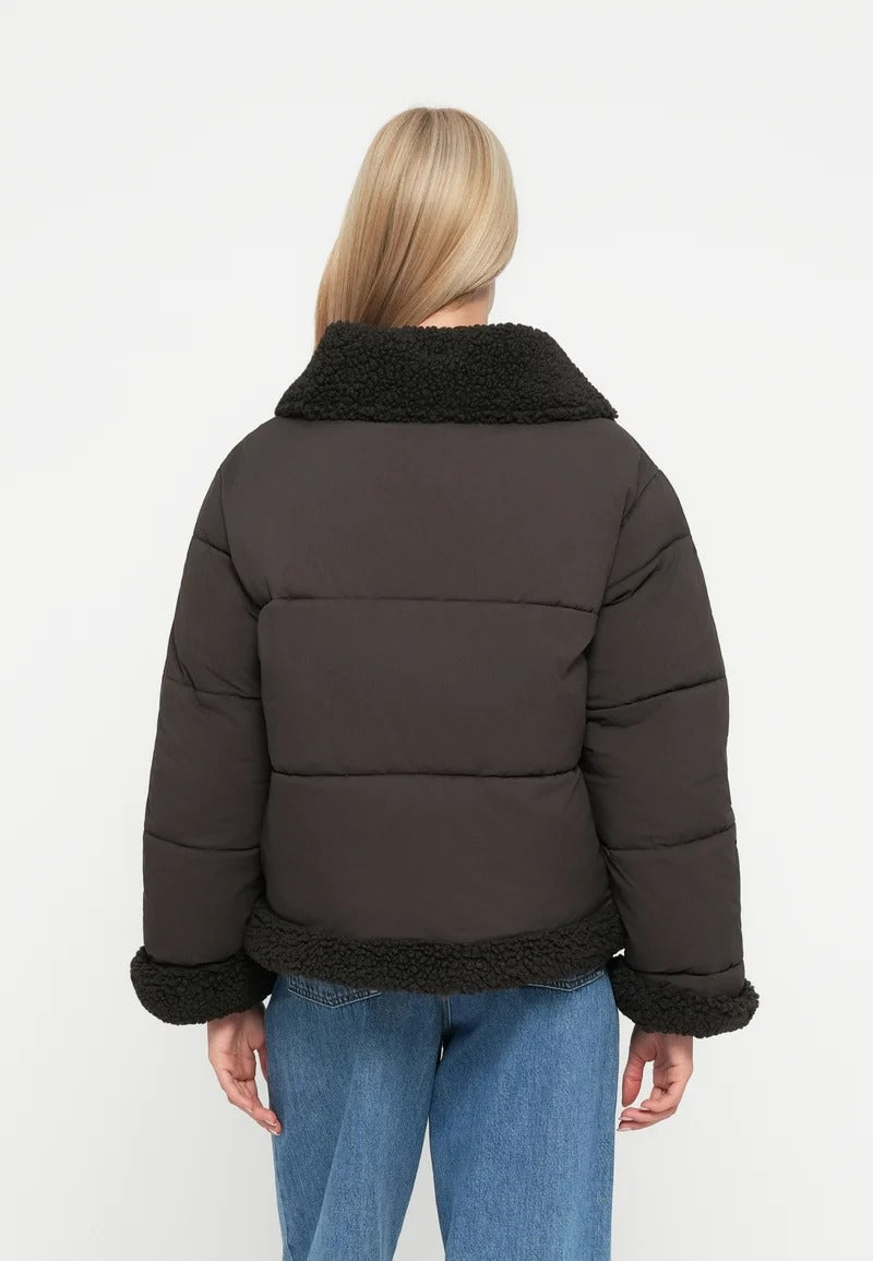Dark brown short puffer jacket with black teddy collar and hem