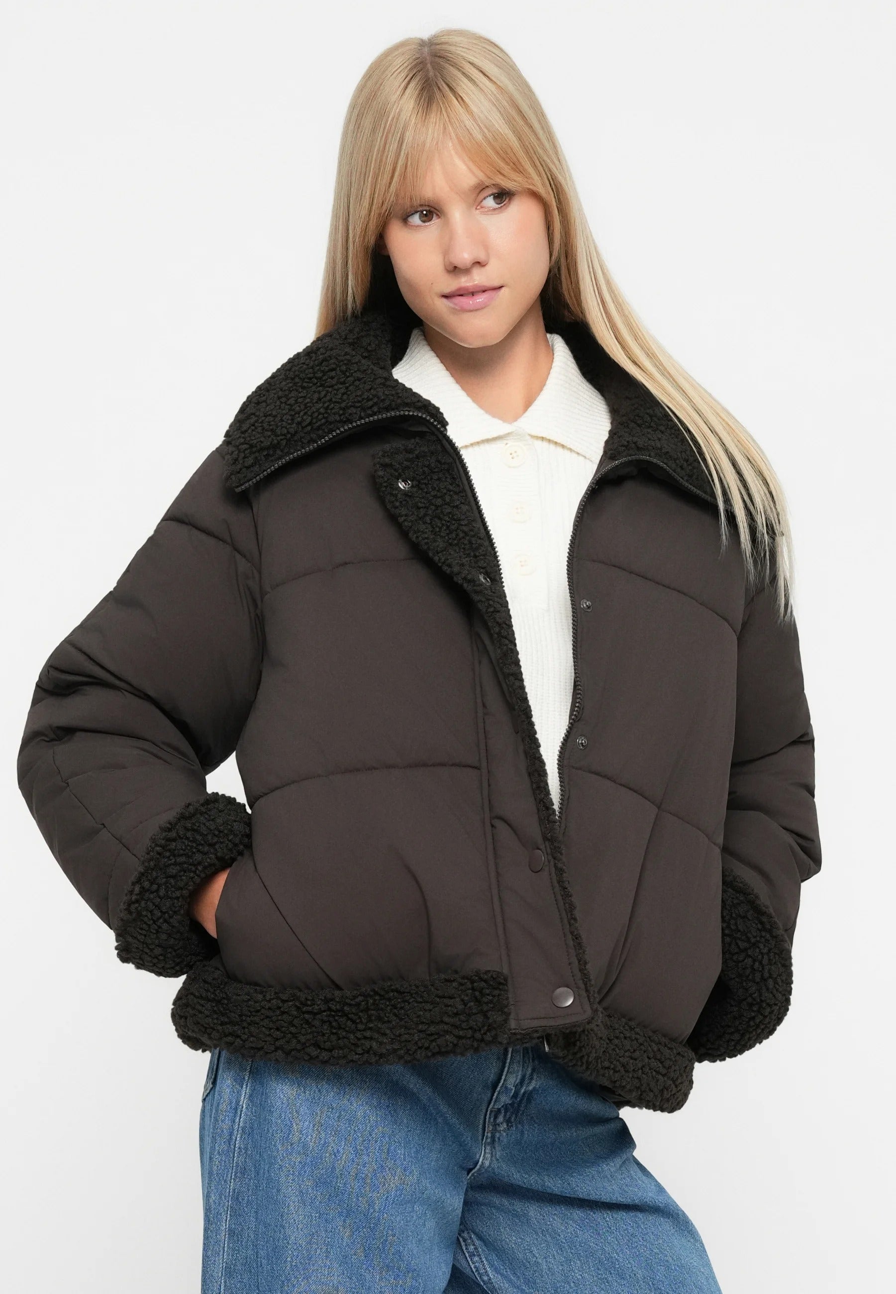 Dark brown short puffer jacket with black teddy collar and hem