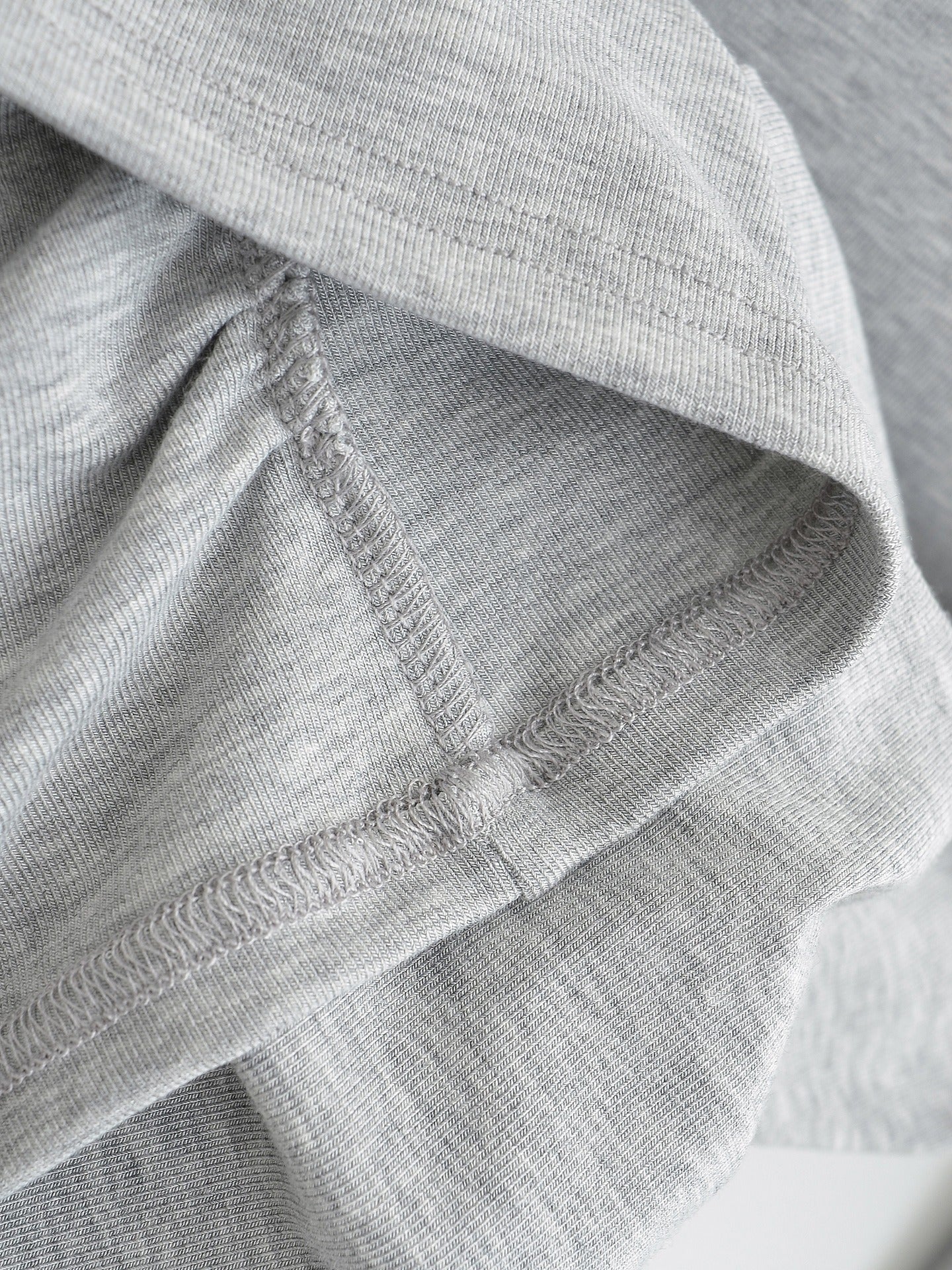 Asymmetrical off-shoulder long-sleeved top with ruched detail