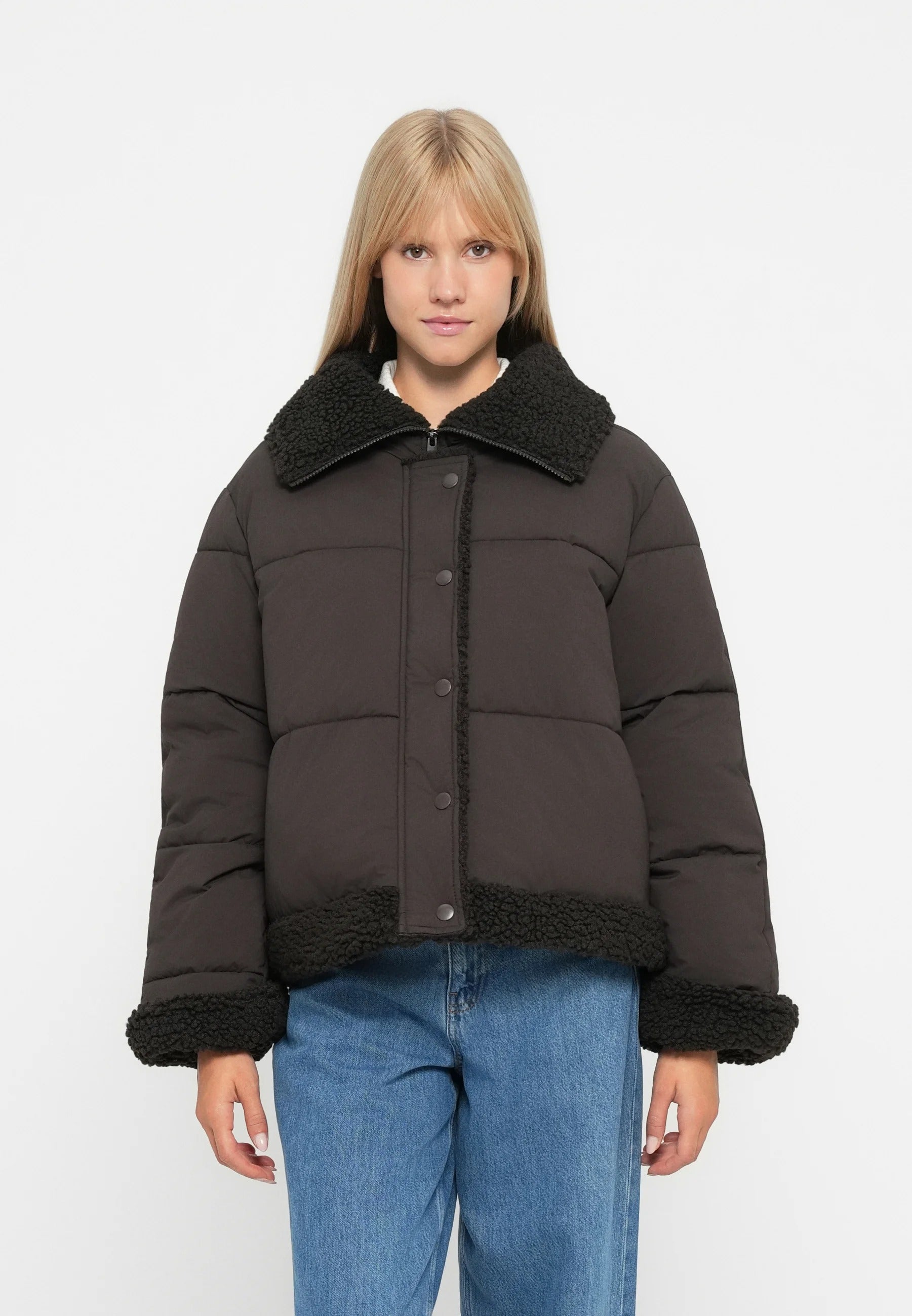 Dark brown short puffer jacket with black teddy collar and hem