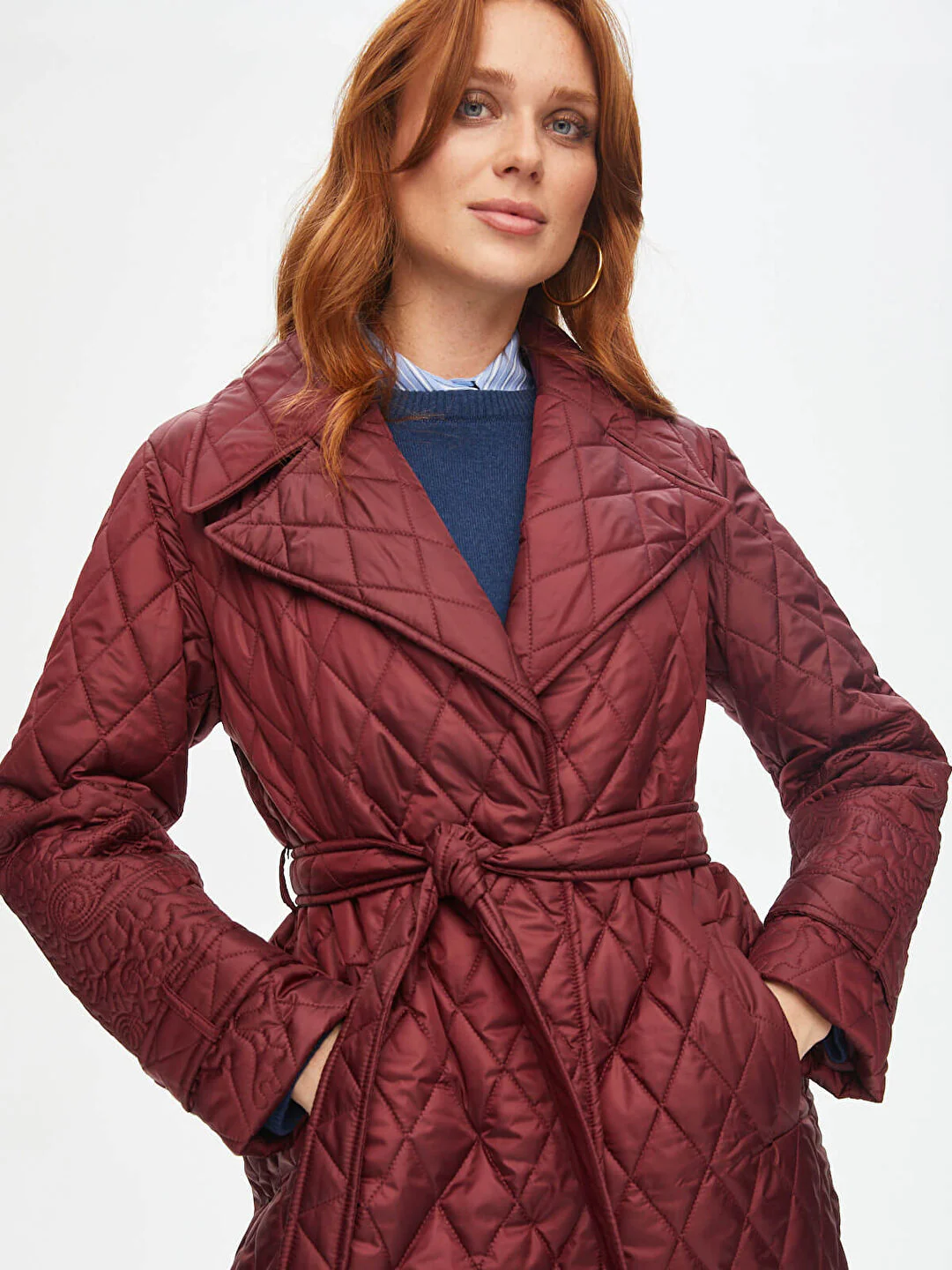 Quilted long coat with floral details