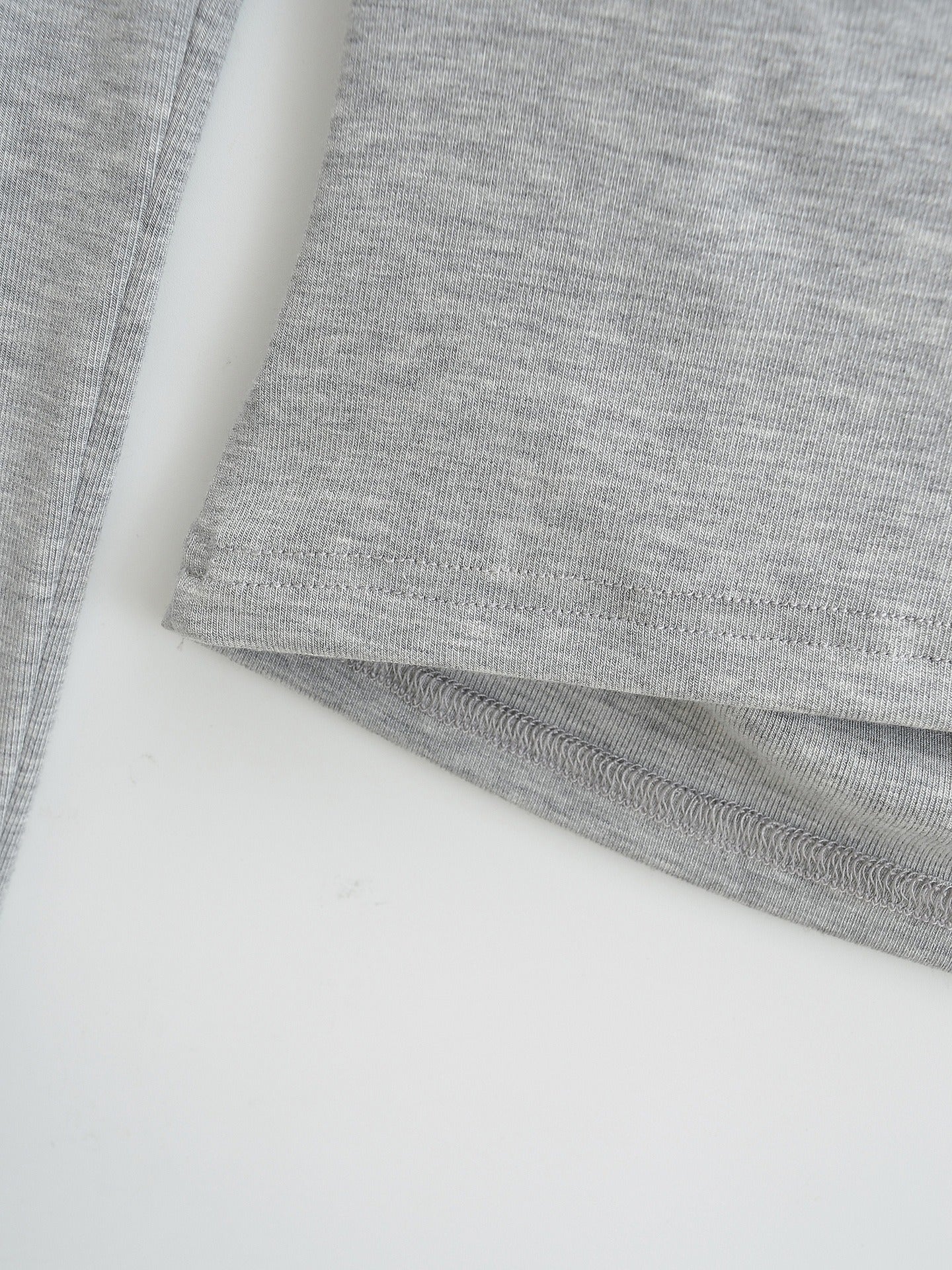 Asymmetrical off-shoulder long-sleeved top with ruched detail