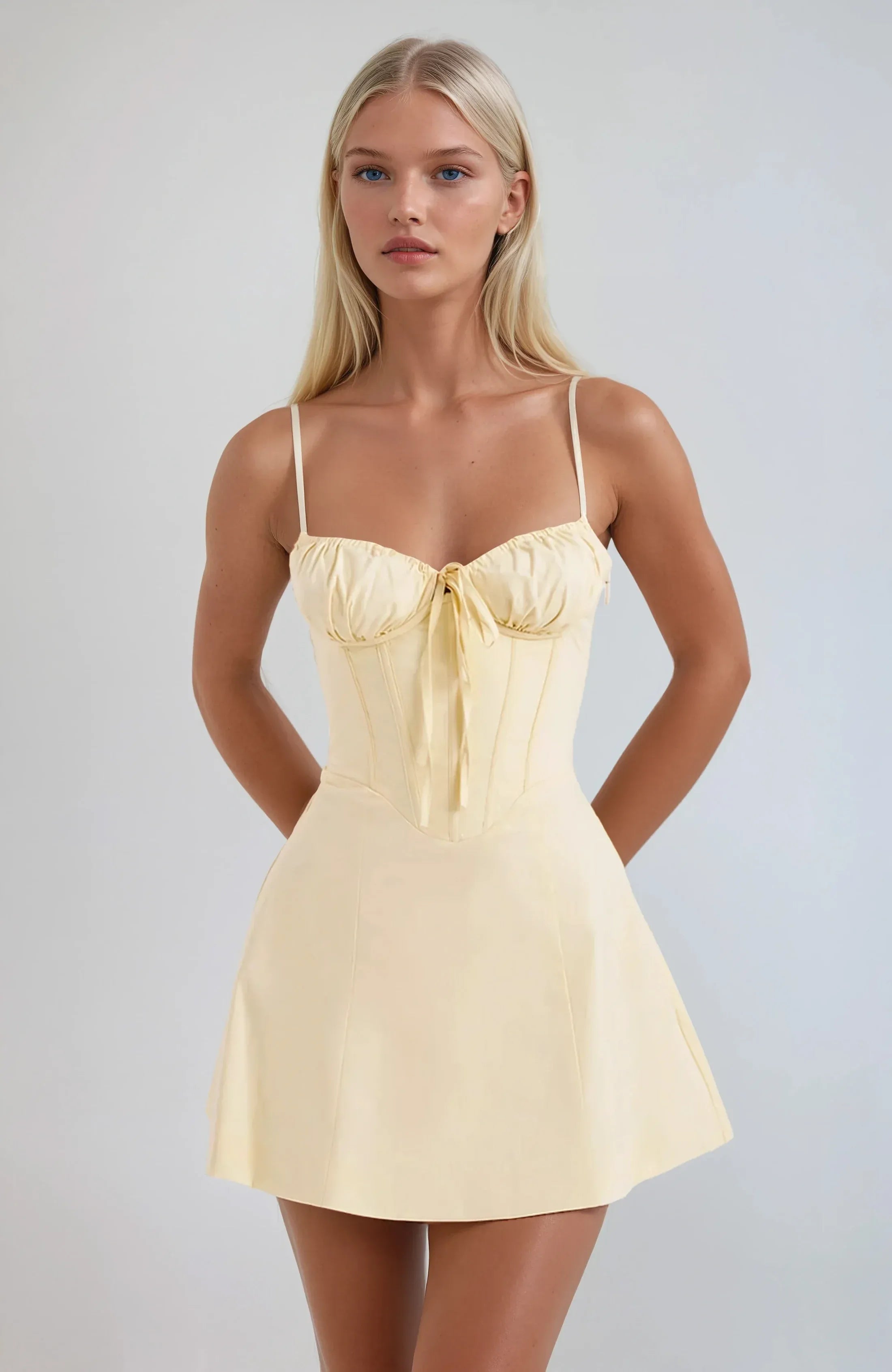 Light yellow strapless mini dress with bow