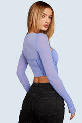 Blå korsett med asymmetriskt snitt