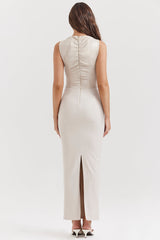 Cream-colored sleeveless wrap maxi dress with v-neck