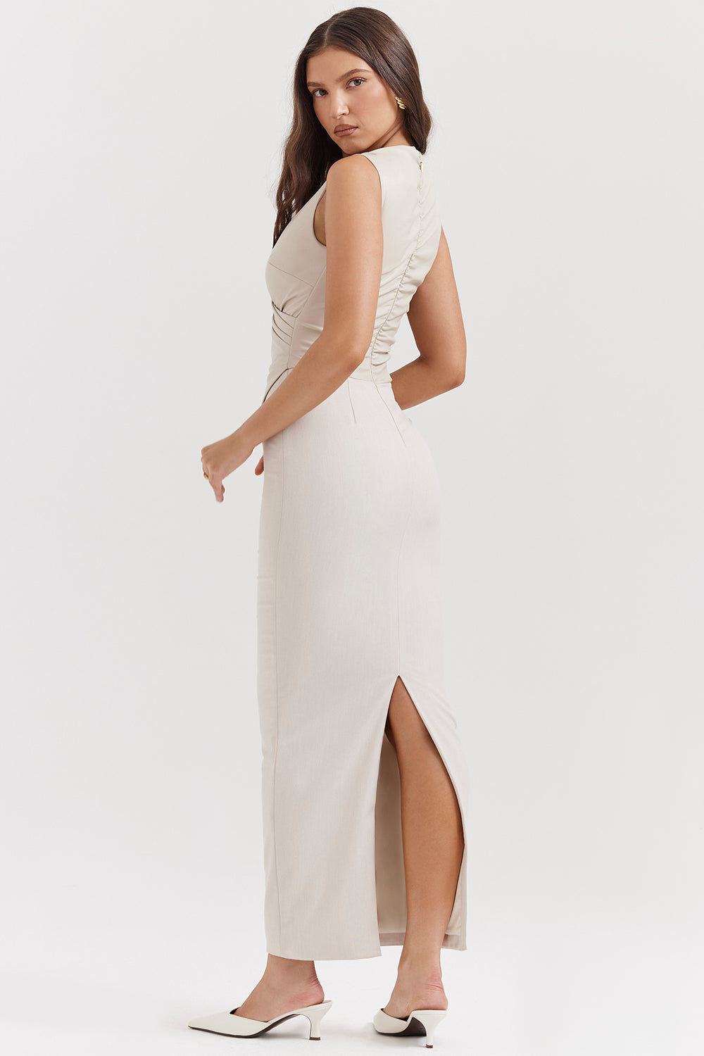 Cream-colored sleeveless wrap maxi dress with v-neck
