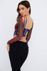 Korsett med lå nga ärmar och tryck