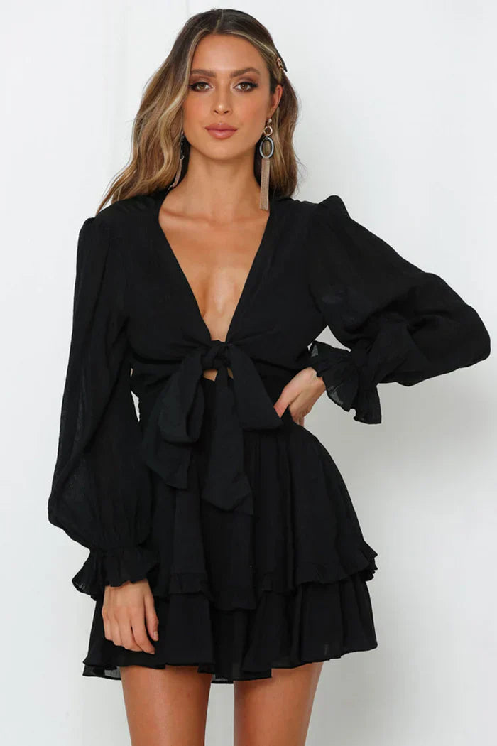 Black mini dress with bow closure and ruffles