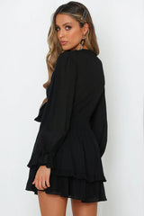 Black mini dress with bow closure and ruffles