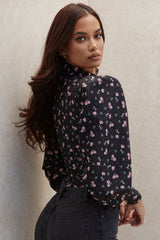 Svart korsettkropp med blommönster