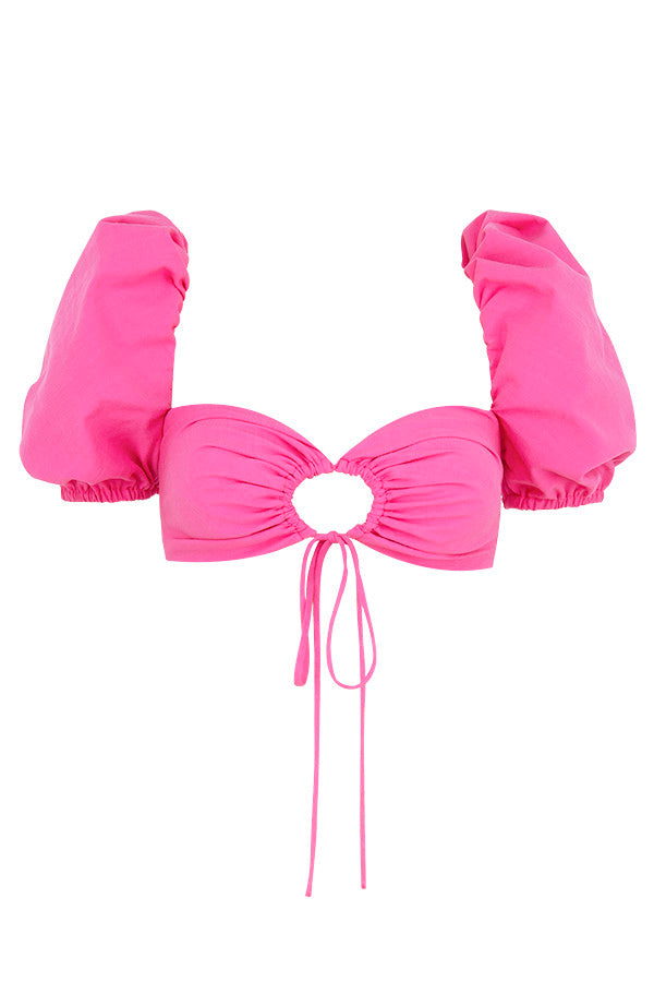 Korsettöverdel i rosa linne med puffärmar och minikjol