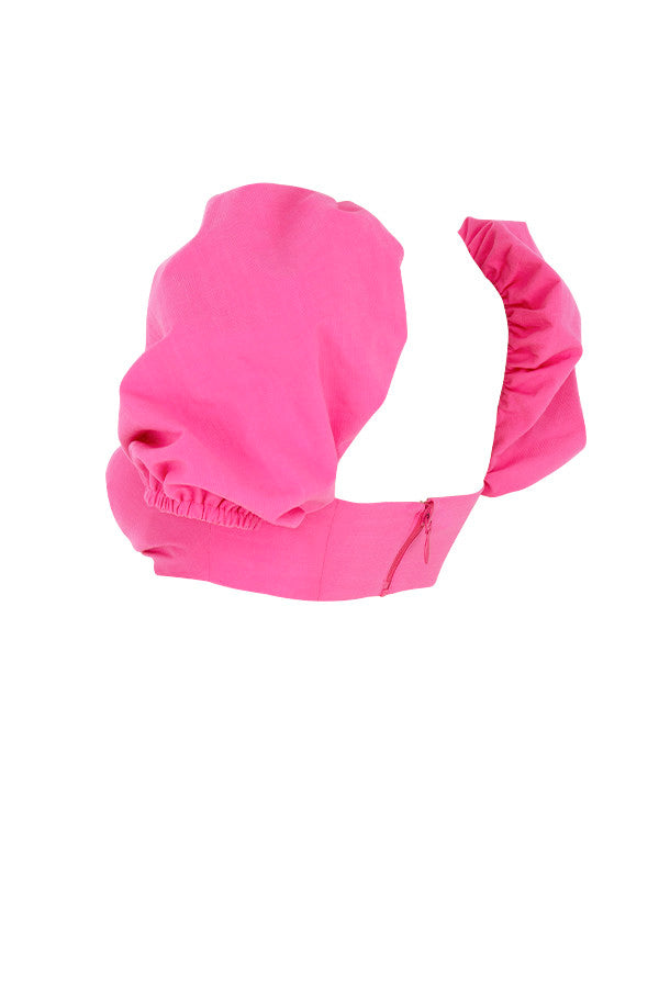 Korsettöverdel i rosa linne med puffärmar och minikjol