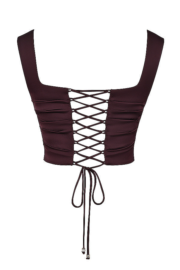 Korsett med spetsrygg och lång kjol