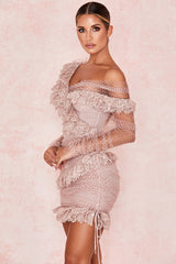 Miniklänning med volanger och transparent ärm