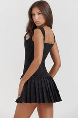 Black corset dress with lace and pleated skirt