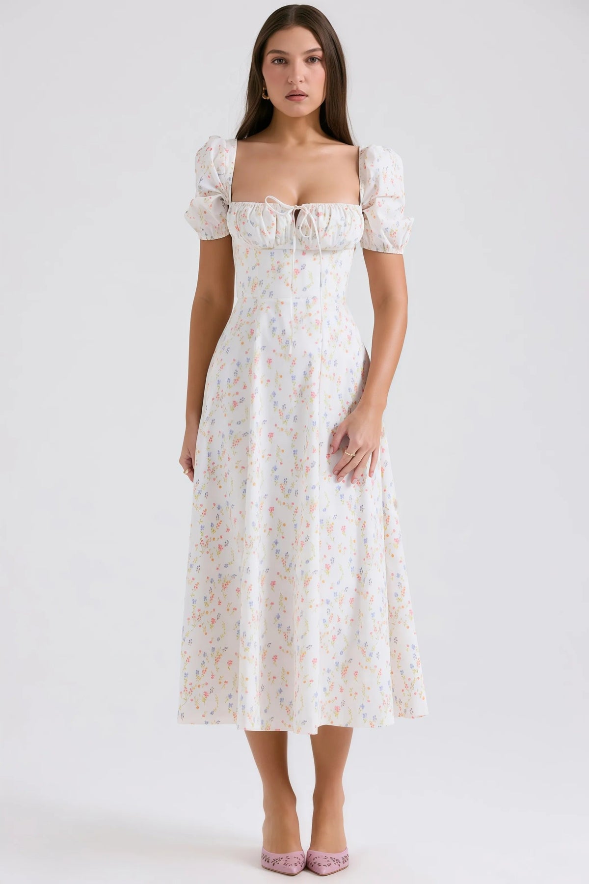 White midi dress with pastel floral pattern and puff sleeves
