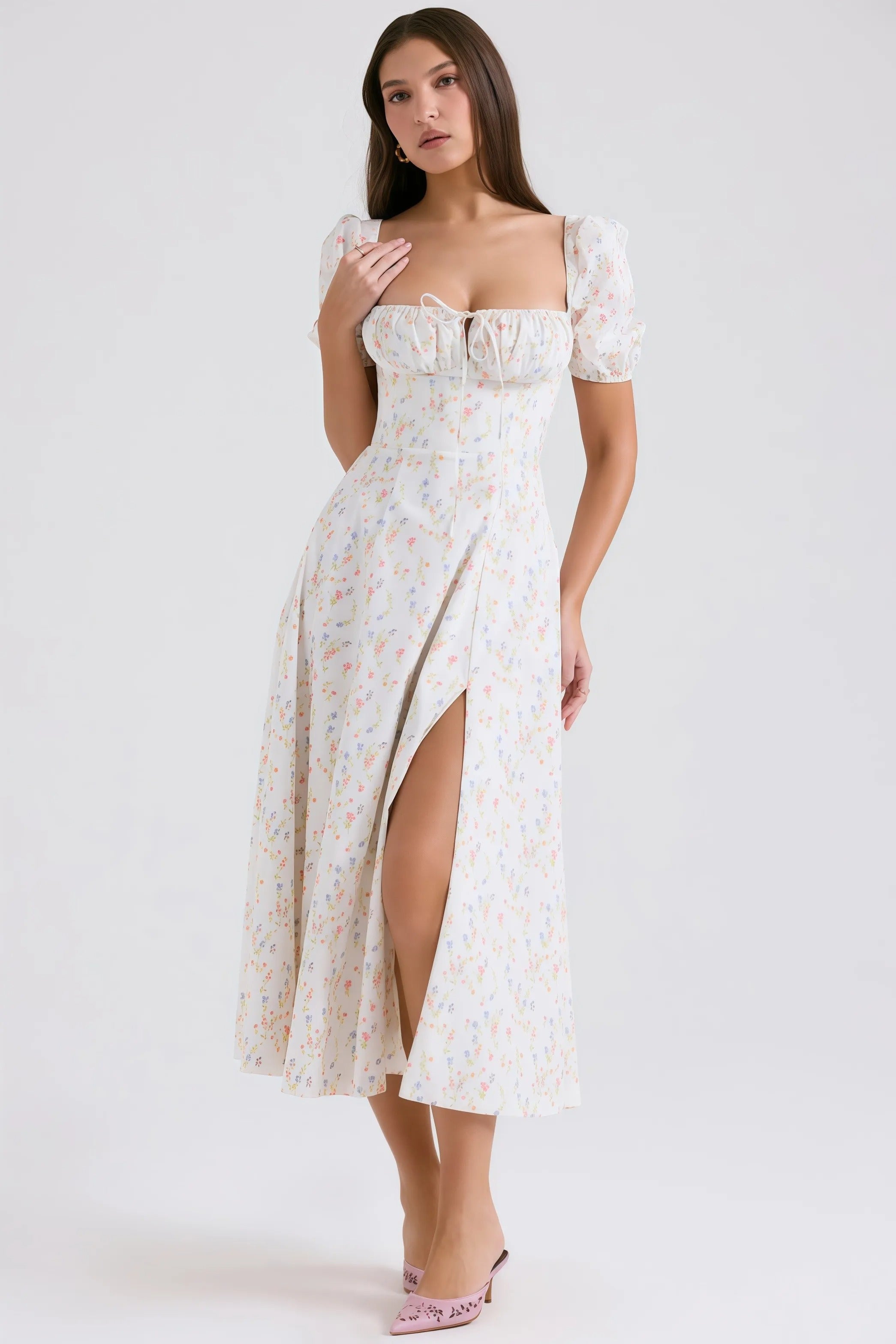 White midi dress with pastel floral pattern and puff sleeves