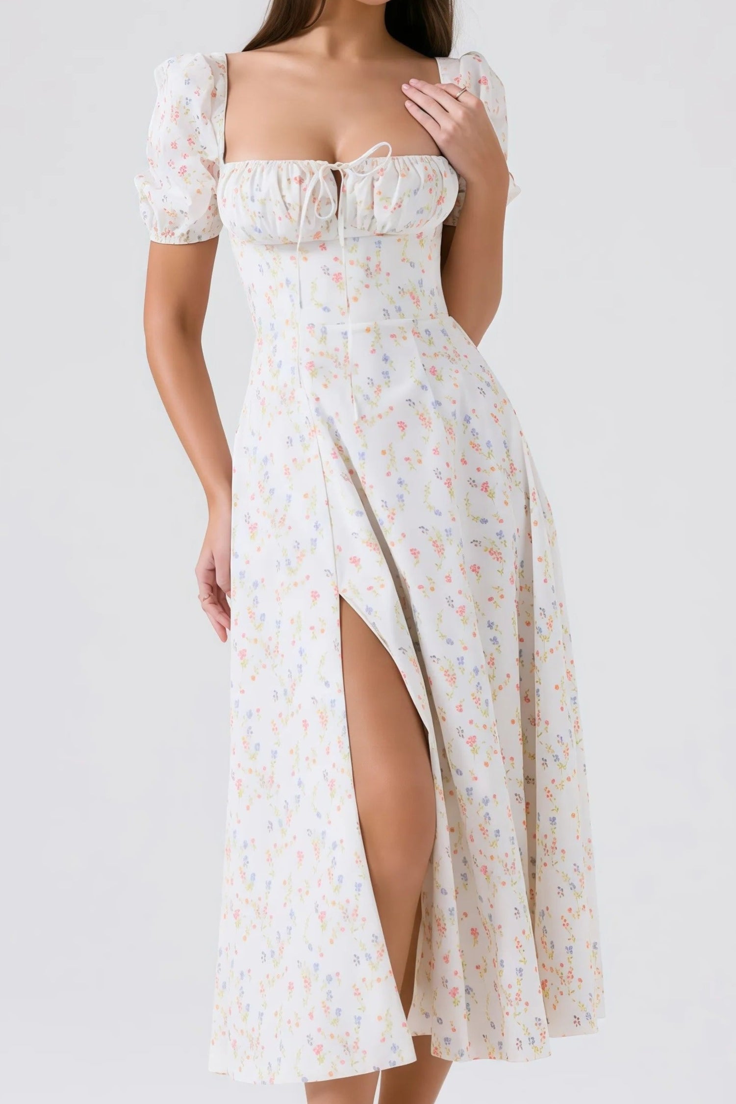 White midi dress with pastel floral pattern and puff sleeves