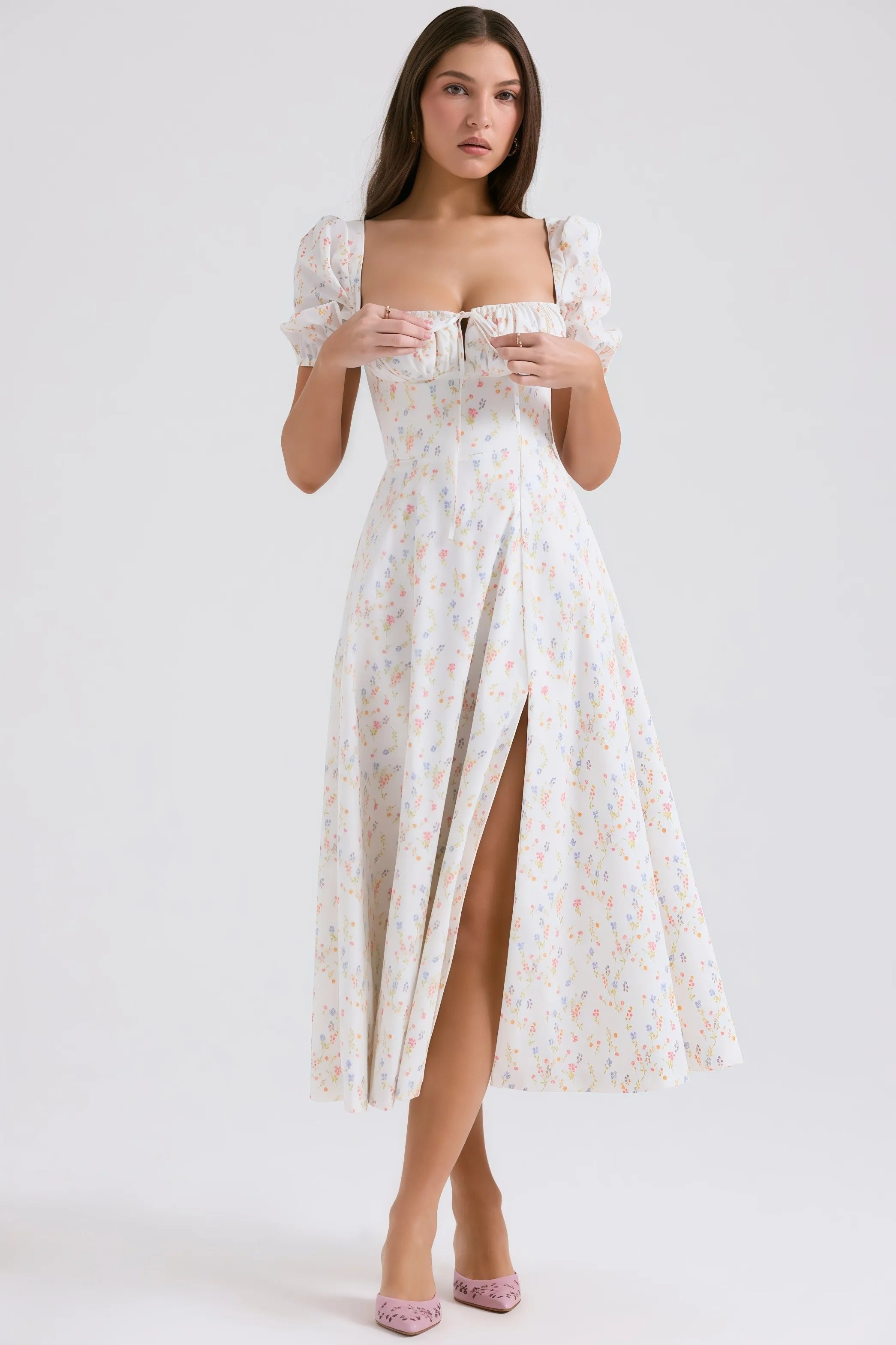 White midi dress with pastel floral pattern and puff sleeves