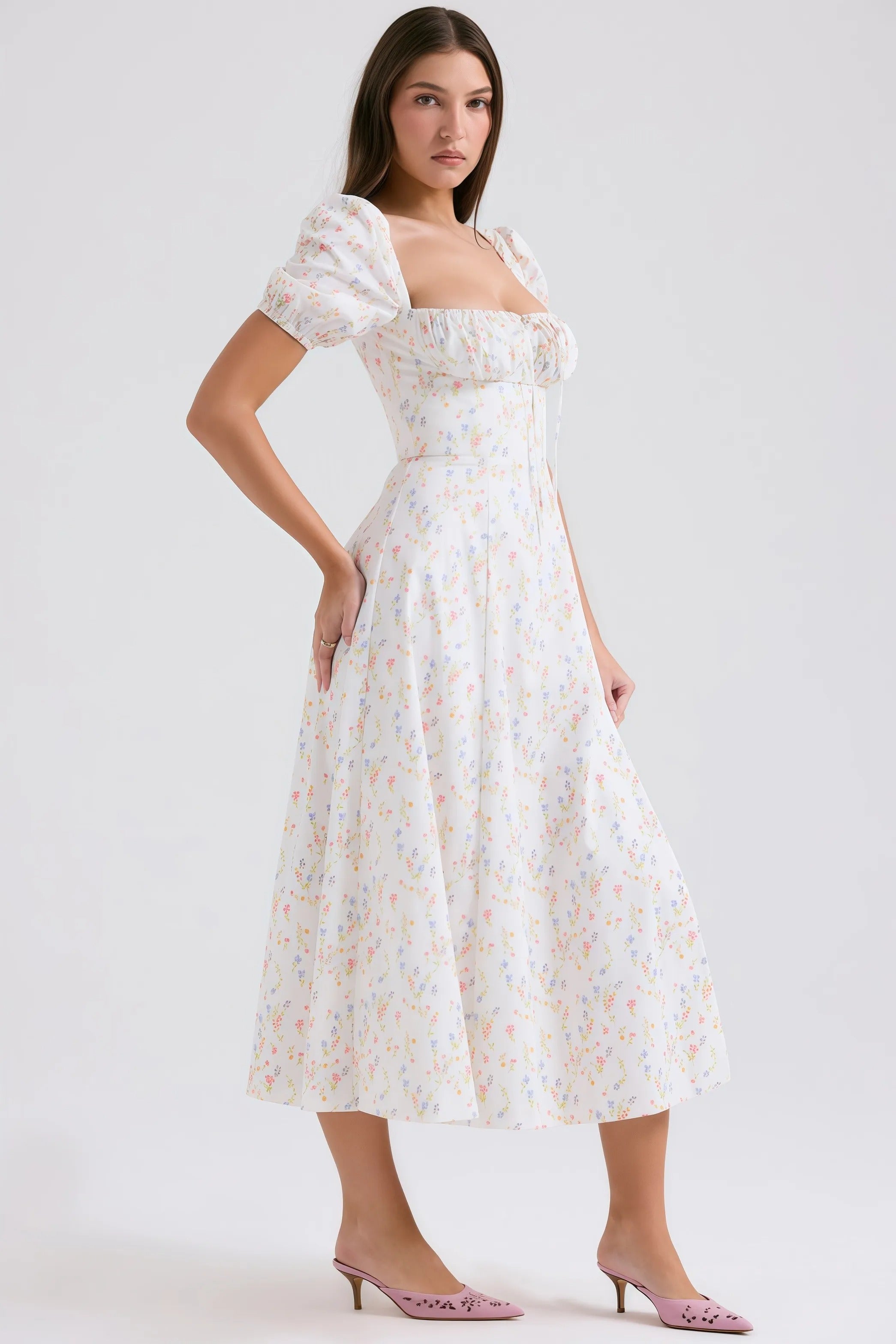 White midi dress with pastel floral pattern and puff sleeves